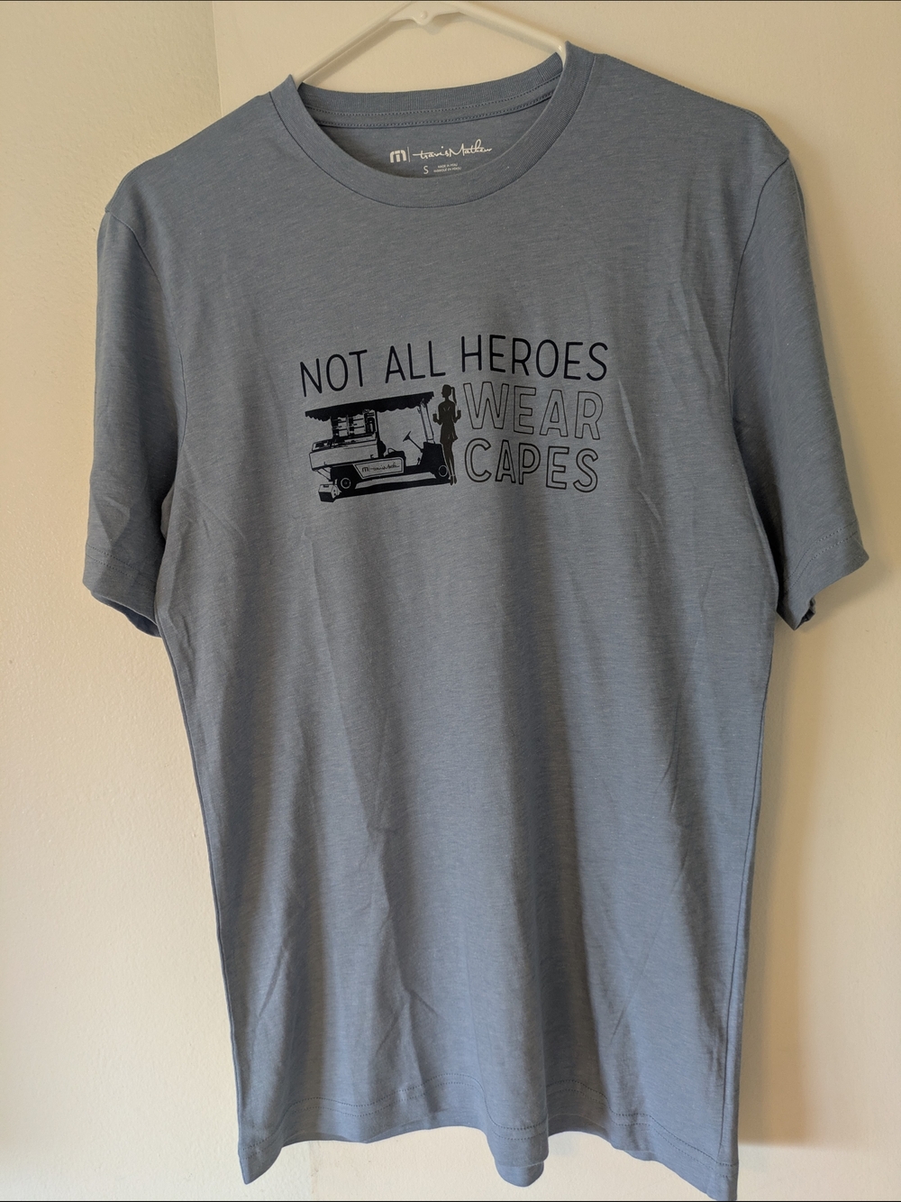 Travis Mathew Men’s Slate Blue Tee - 'Not All Heroes Wear Capes'- Sm (NWOT)